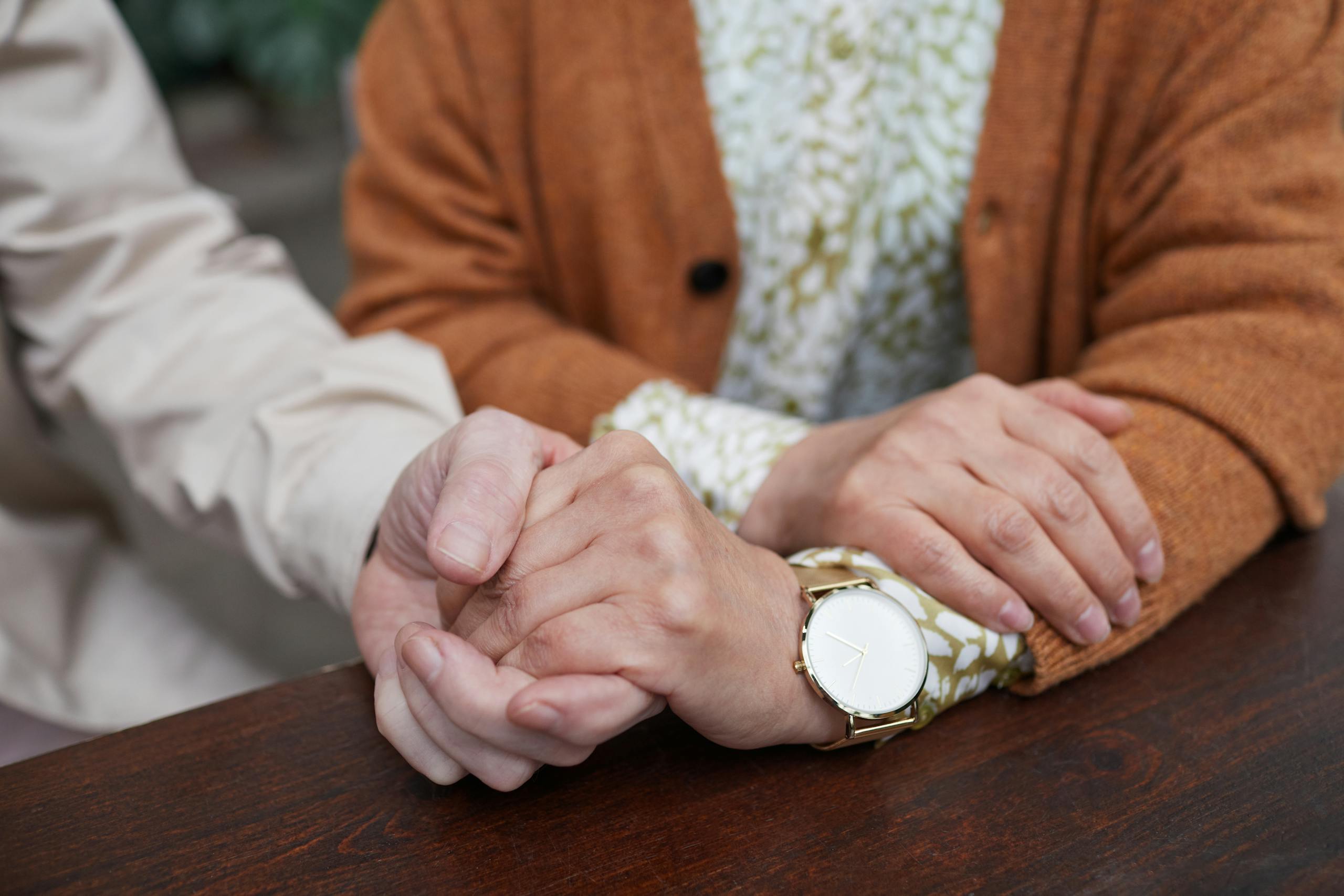 Close-up of senior couple's hands showing love, support, and togetherness.